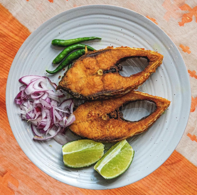 Ilish Mach (Hilsa Fish, aka fried fish) served on a plate