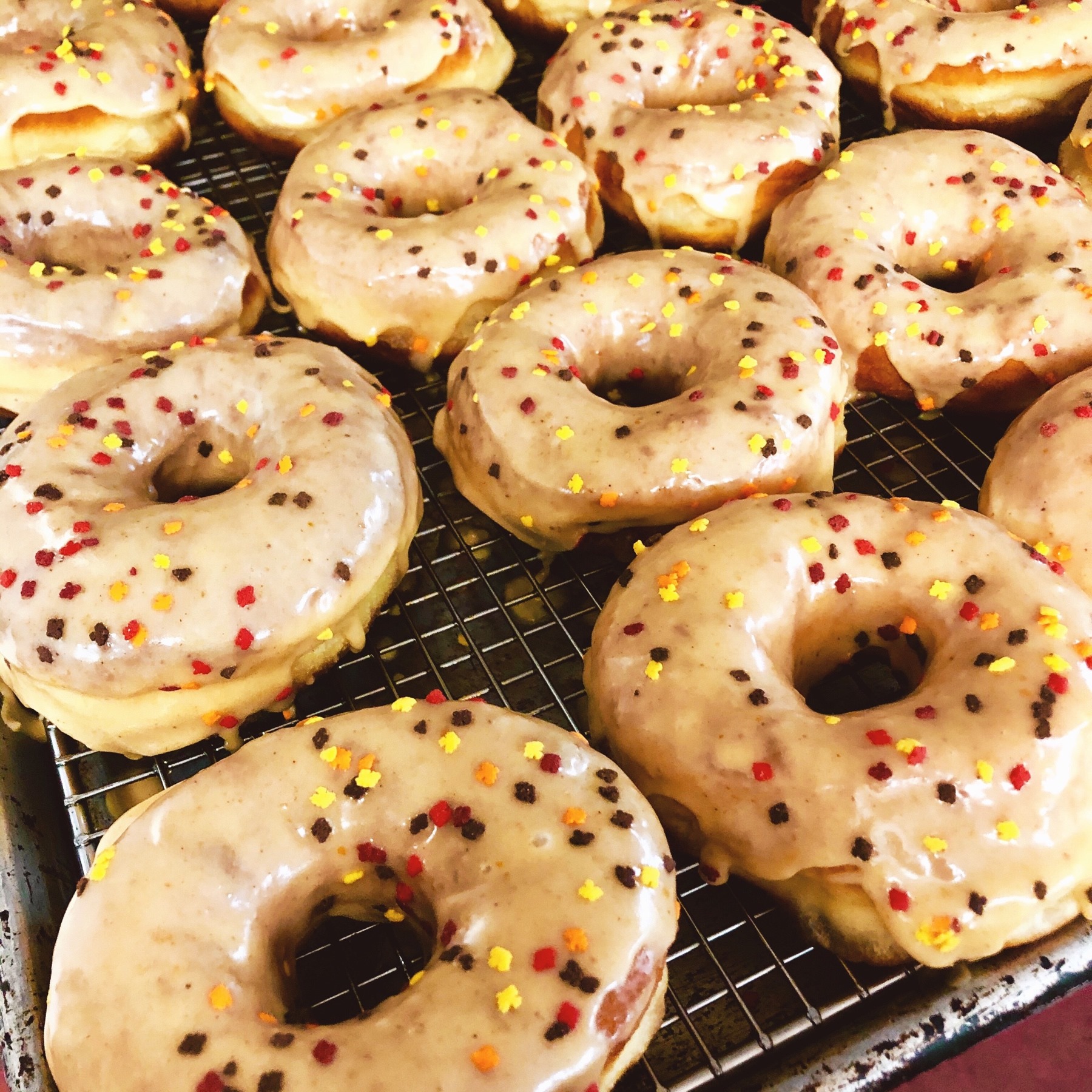 glazed donuts on tray with sprinkles