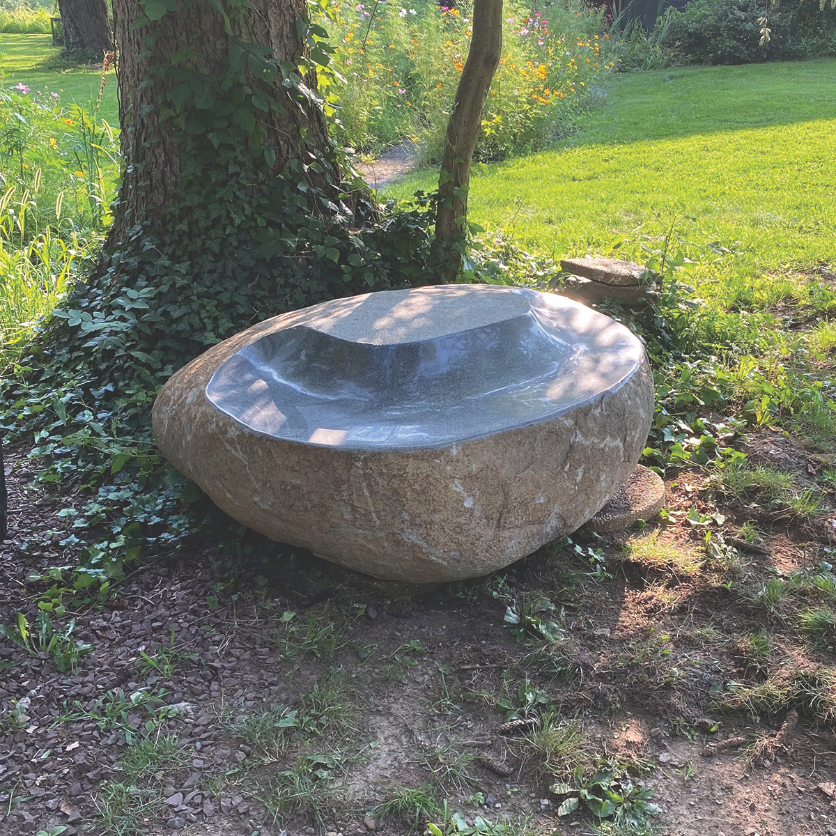 Justin Anchinsko following in the footsteps of his father, Steven Snyder, to create bold stone benches!