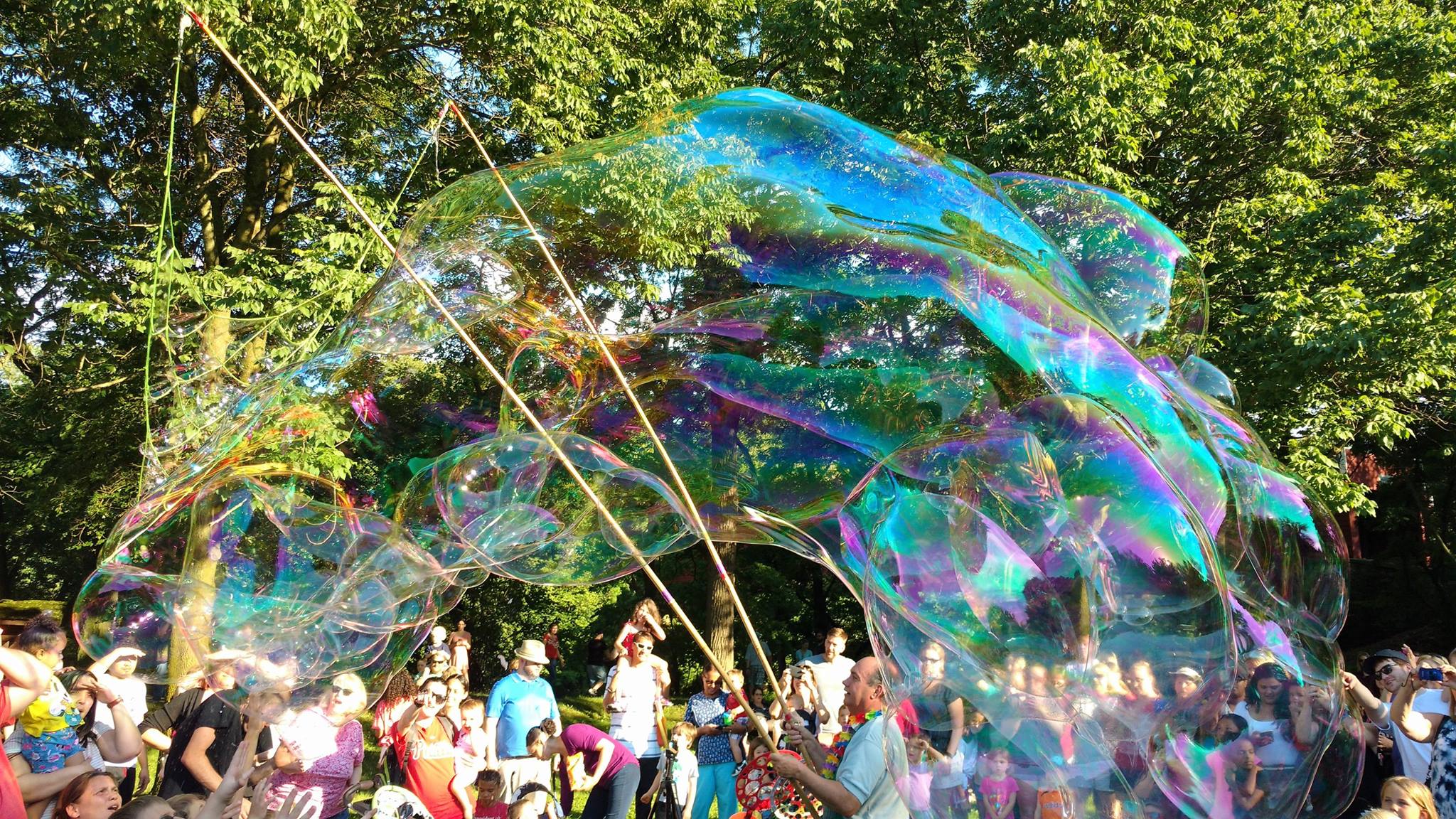 Young girls and boys make GIANT bubbles with @GrandppBubbles at Grandpp Bubbles' "Free Bubble Festivals."