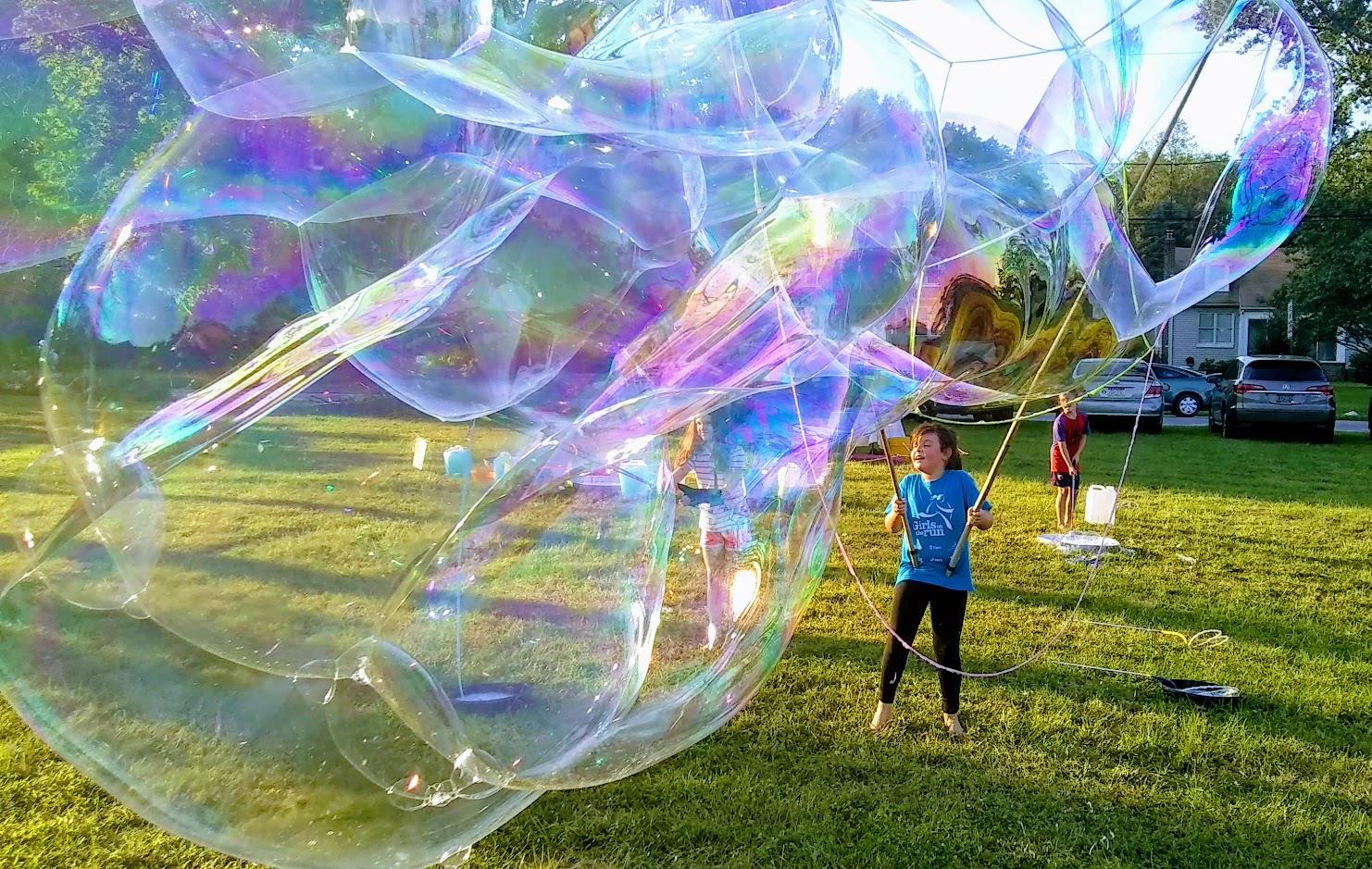 Young girls and boys make GIANT bubbles with @GrandppBubbles at Grandpp Bubbles' "Free Bubble Festivals."