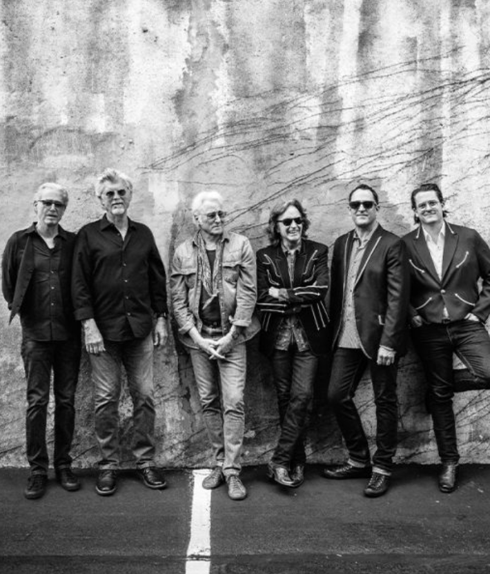 Black and white image of the Nitty Gritty Band outside