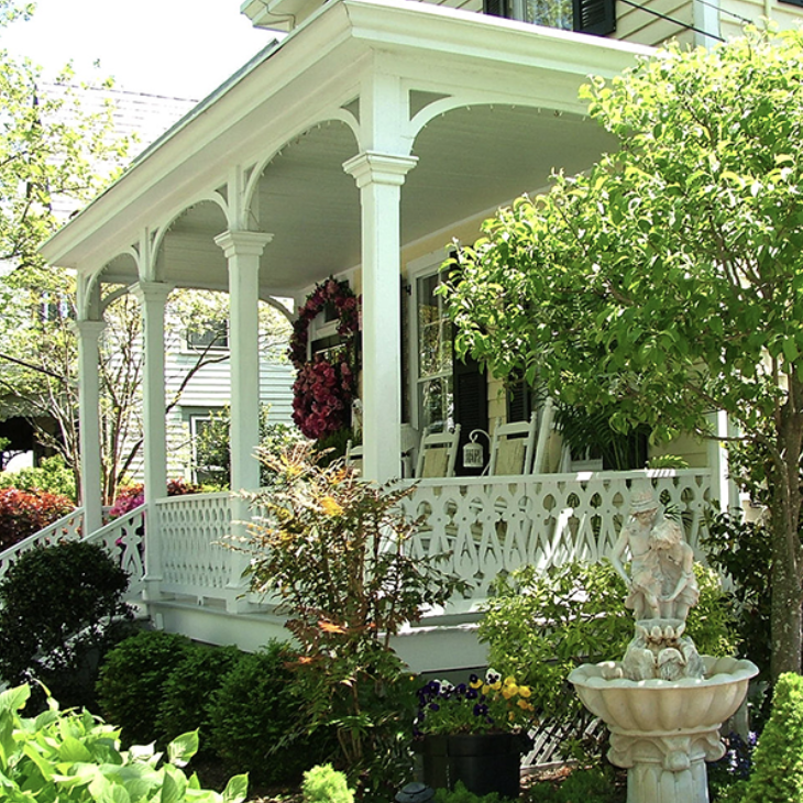 white porch with greenery