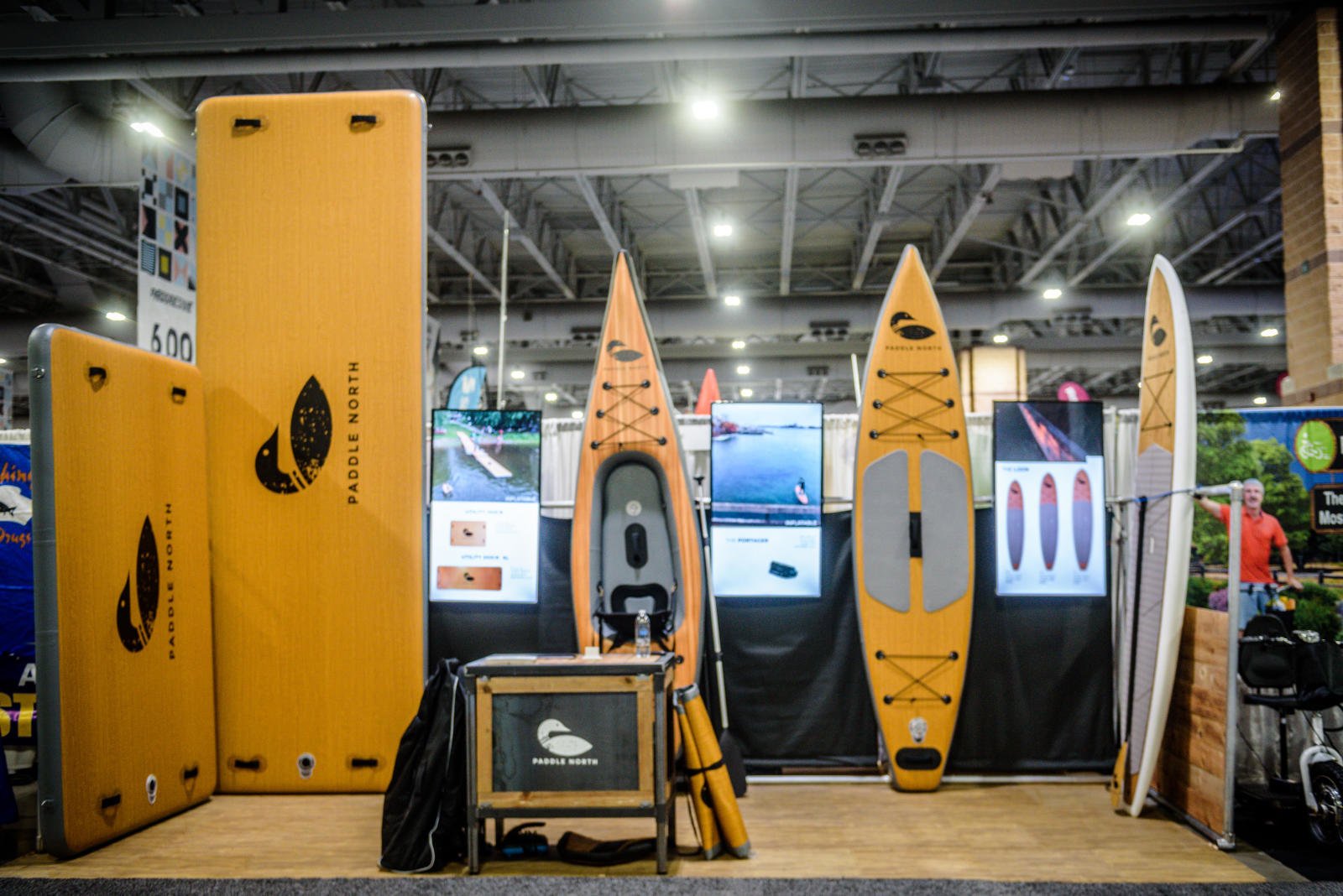 kayaks and standup paddleboards on display