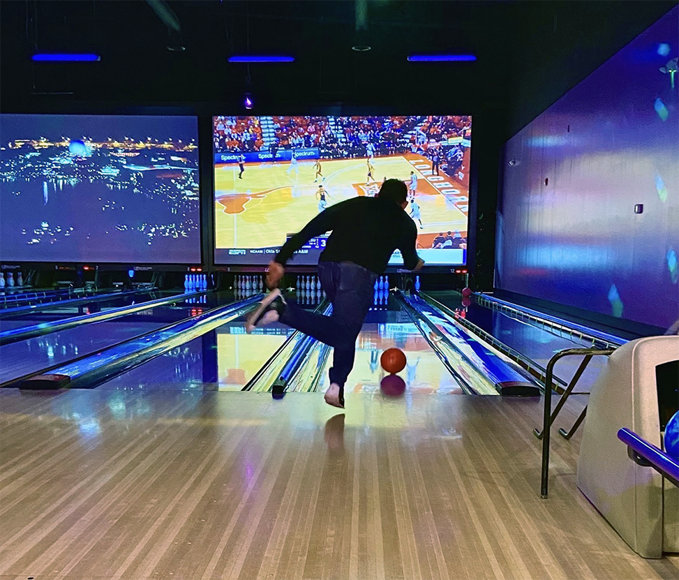 man bowling with lights