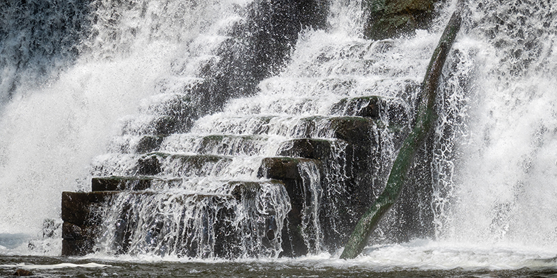 A man-made waterfall, specifically a dam located in the Ken Lockwood Gorge along the Columbia Trail in New Jersey. 