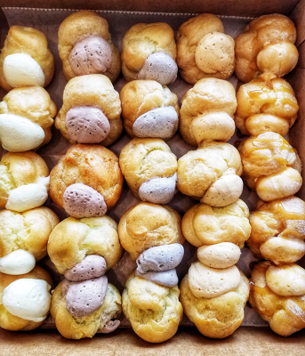 assorted creme puffs lined up