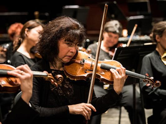 Adriana Rosin rehearsing alongside fellow members of the New Jersey Symphony