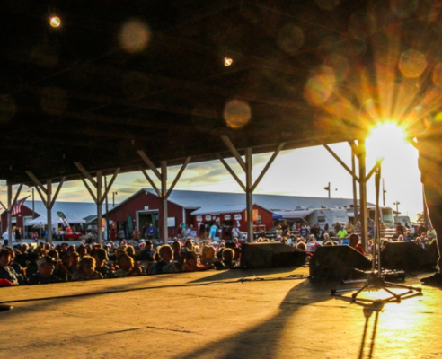 Crowd viewing the stage in the afternoon