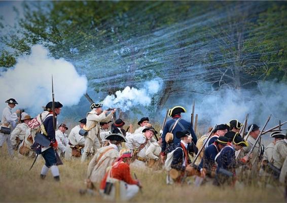 Revolutionary war soldiers firing muskets