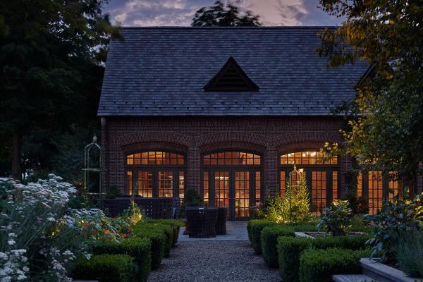 exterior of ninety acres restaurant and garden at dusk