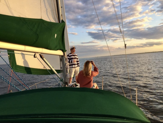 couple sitting aboard deck