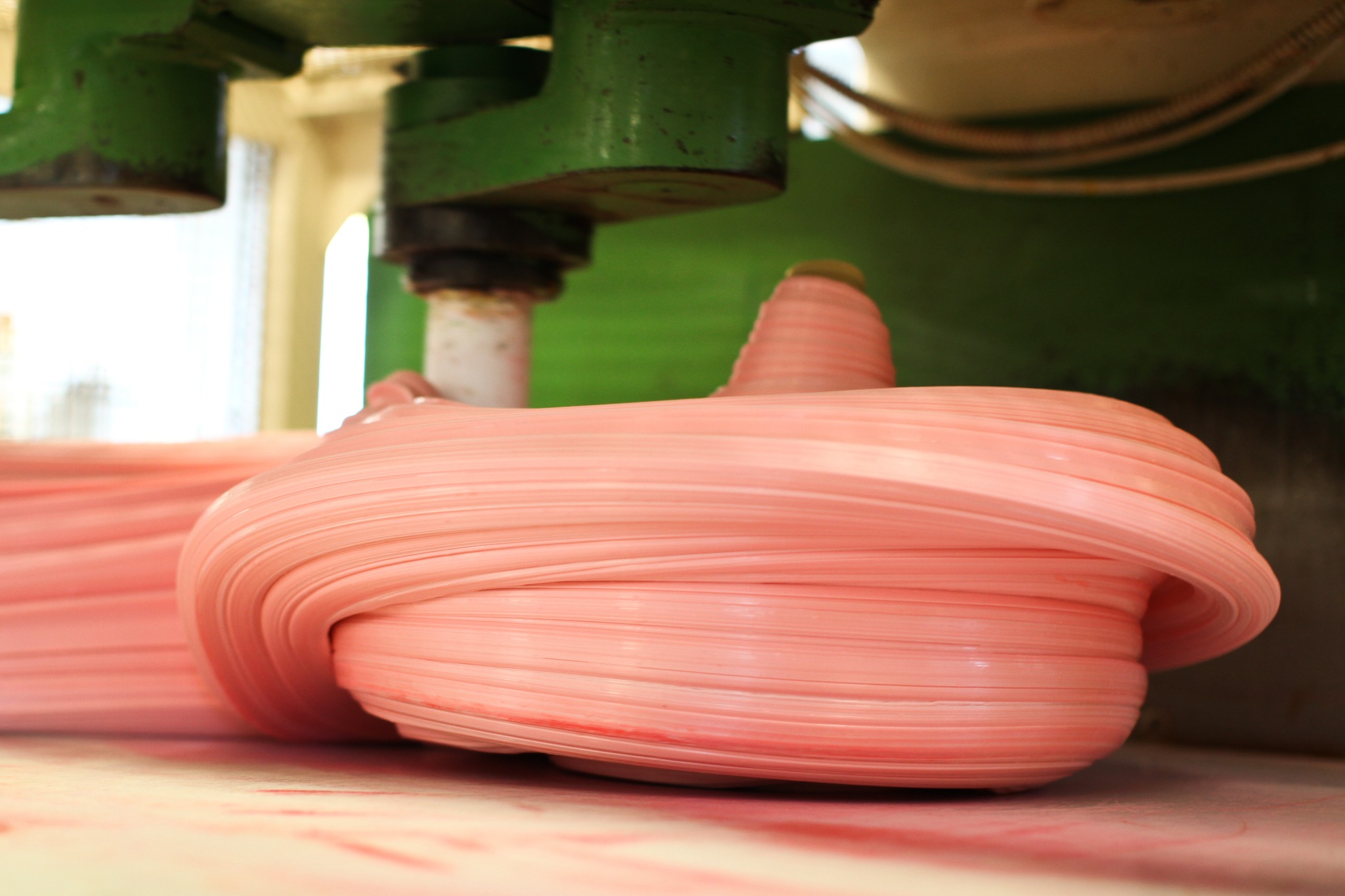 pink taffy being rolled